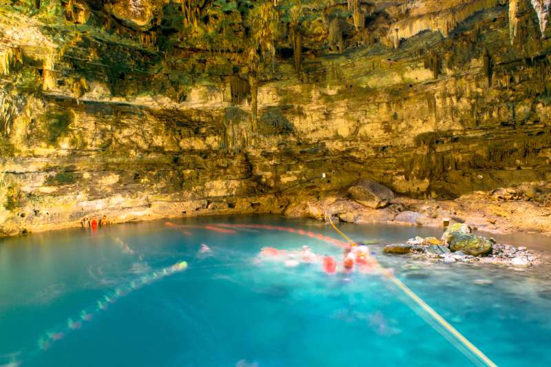 People swimming in cenote Samula 