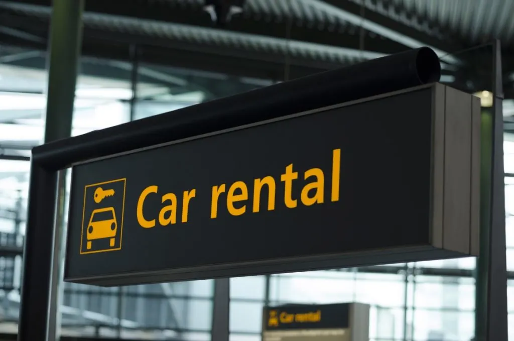 Car rental sign at Cancun Airport.