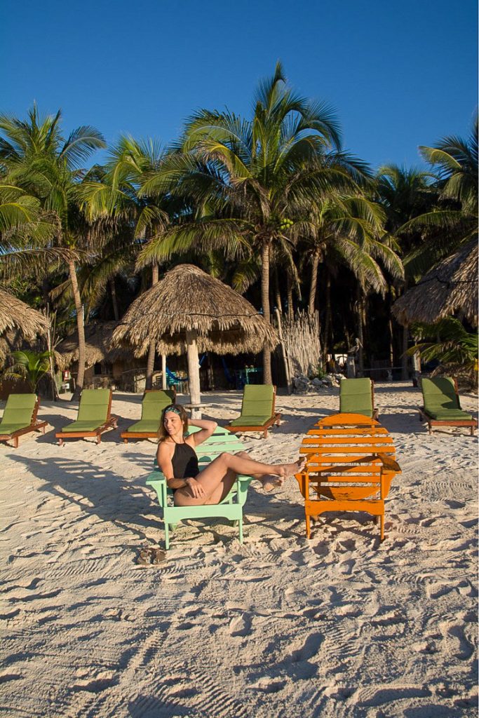 A woman sitting on a beach chair in Zamas private beach 