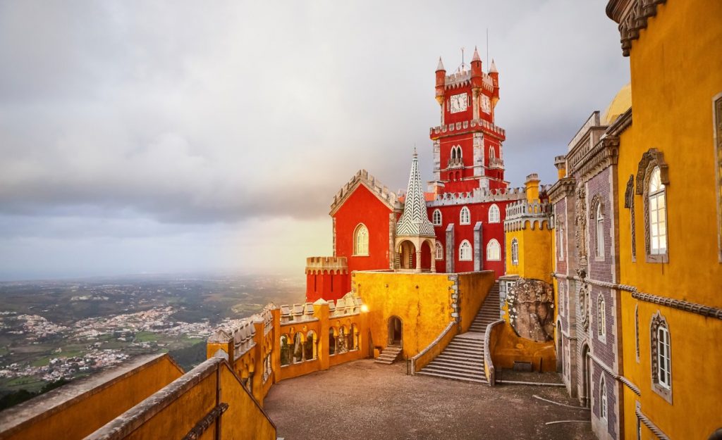 Colorful exteriors of the Pena Palace, one of the Sintra castles that visitors shouldn't miss.