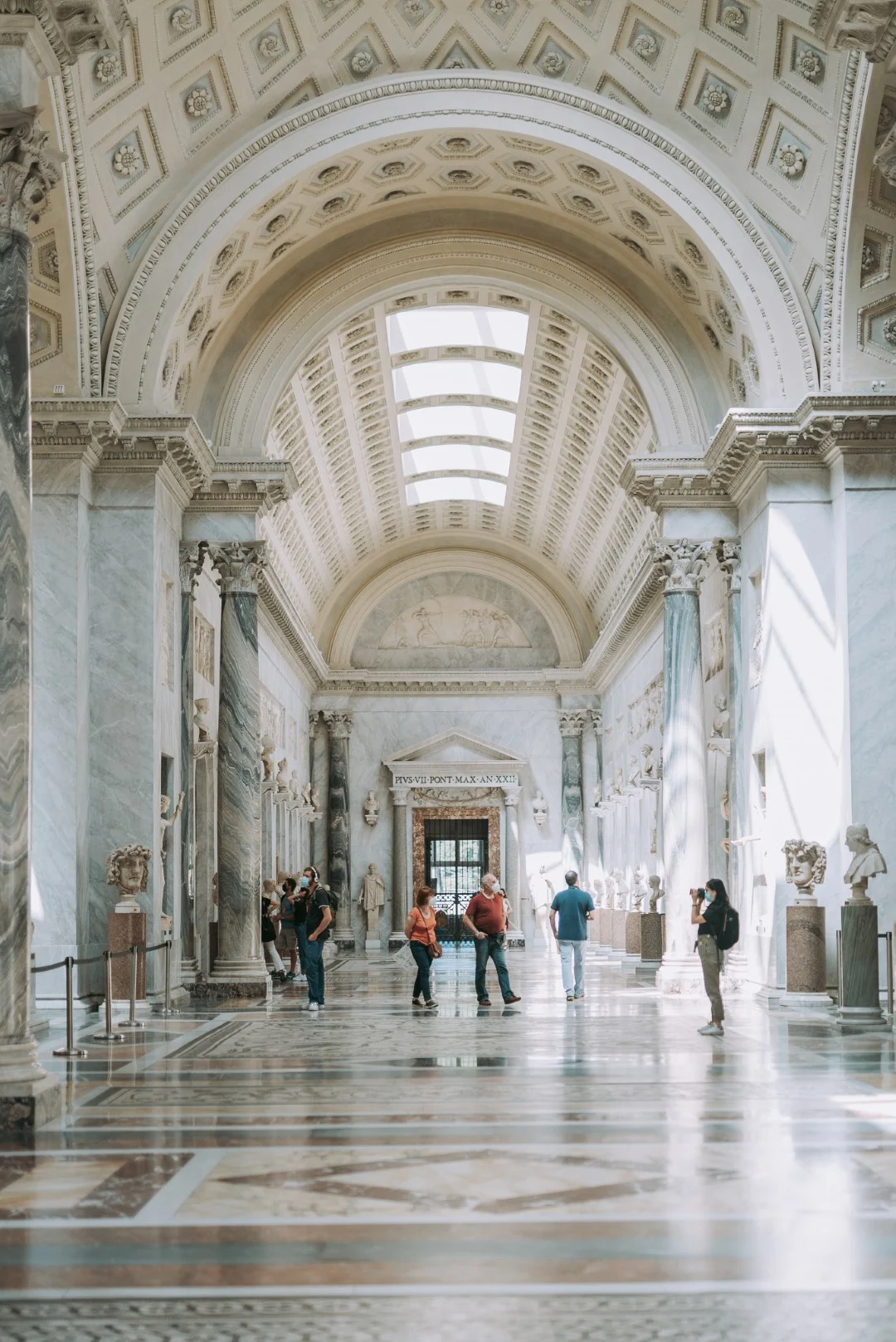 The sistine chapel, with marble columns and arched ceilings