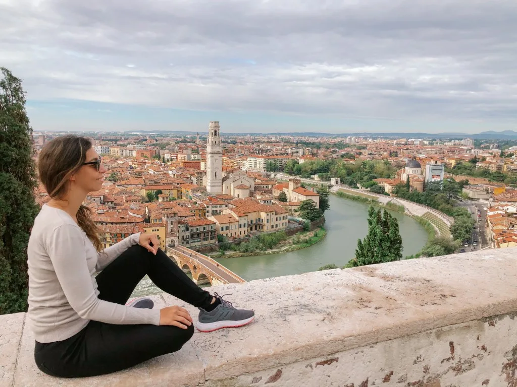 A woman admiring the views of Verona from a vantage point