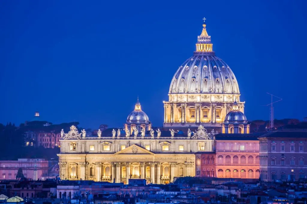 St Peter's Basilica completely lit up, set against the night's sky