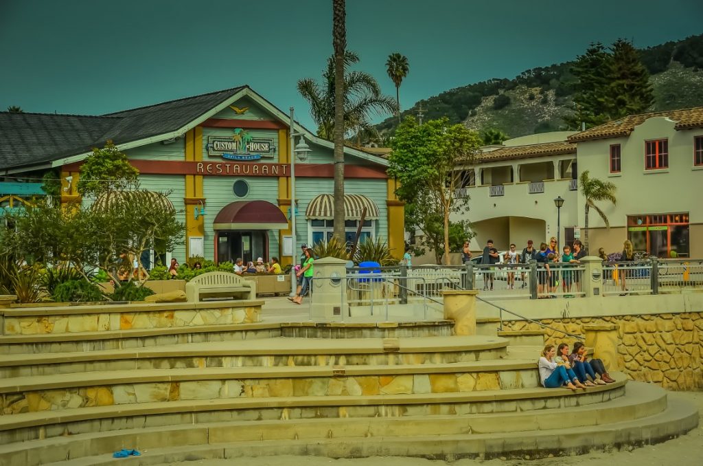 An image of a pastel-green colored restaurant, with wide stairs leading to the beach, inserted in a post about things to do in Avila Beach California