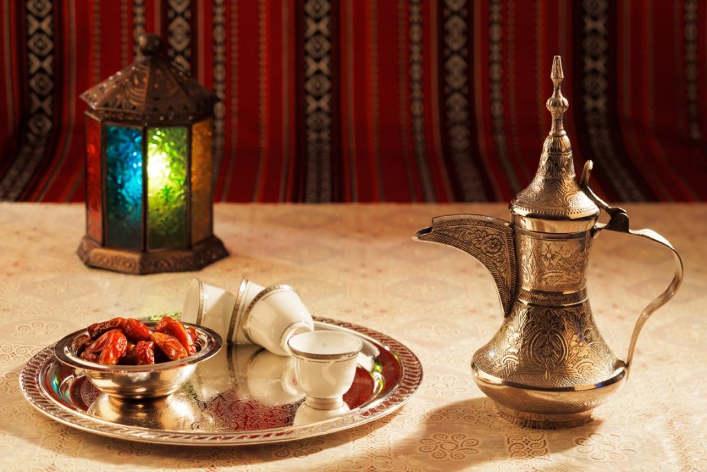 Photo of Arabic coffee and dates, traditional food of Dubai.