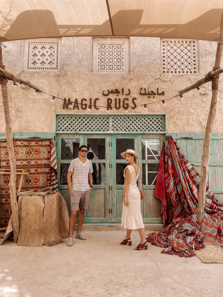 A couple in front of an old-looking building in Al Seef, Dubai, inserted in a post about Winter in Dubai. 
