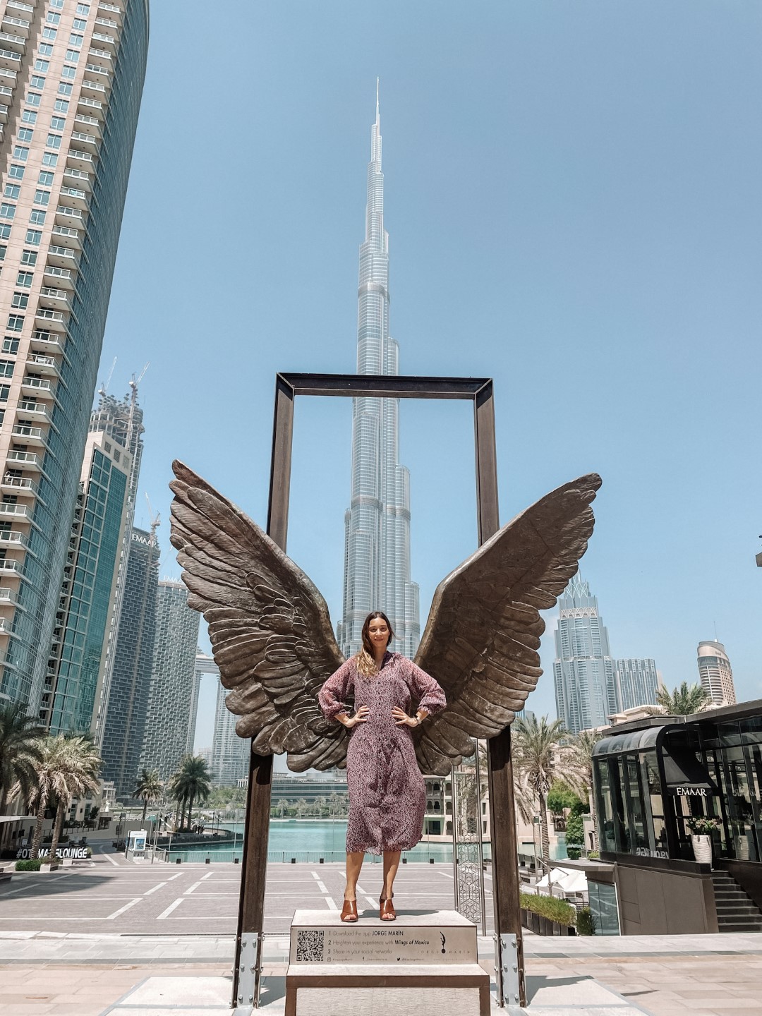 Image of a woman in front of the Burj Khalifa, inserted in a post about the best things to do in Dubai.