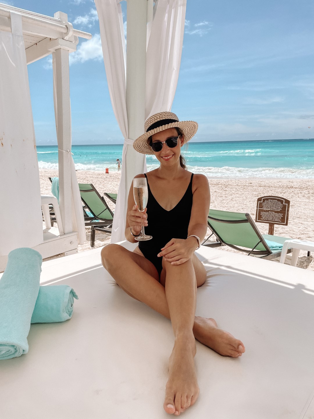 Image of woman in a beach cabana at Wyndham Alltra Cancun.