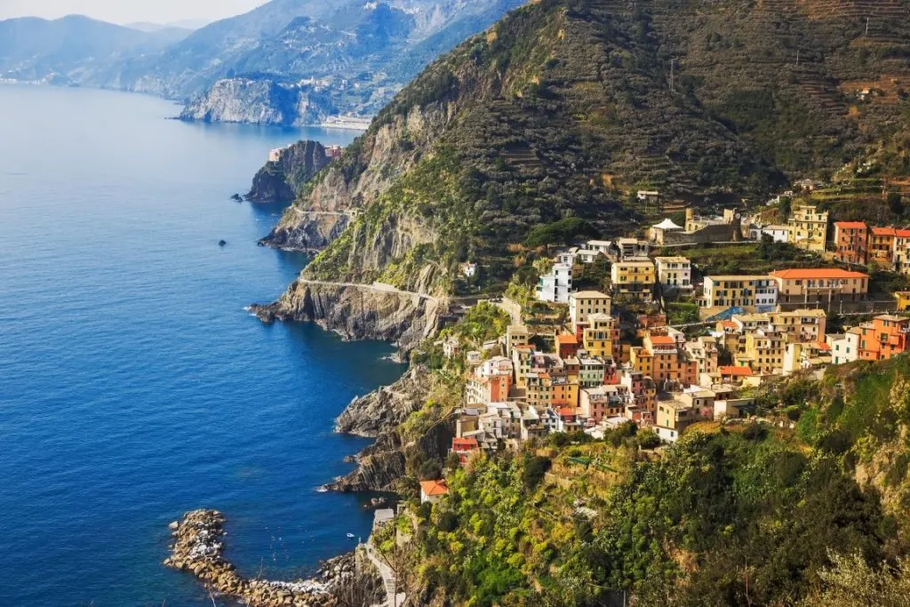 Aerial view of a Cinque Terre village with colorful houses above the Ligurian Sea