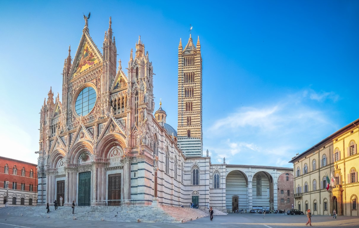 Siena Cathedral’s decorated marble facade and striped bell tower.