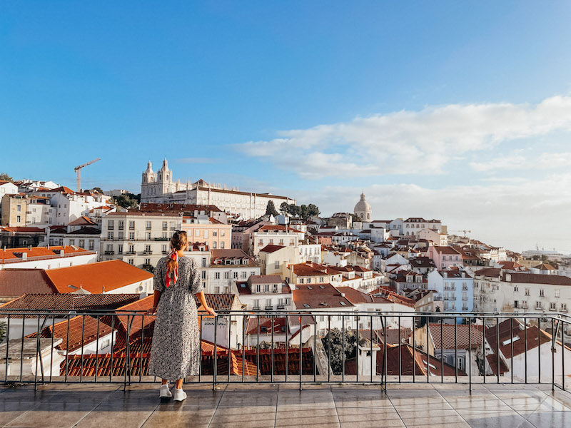 A city view of Lisbon from Miradouro das Portas do Sol inserted in a post about spending one day in Lisbon.