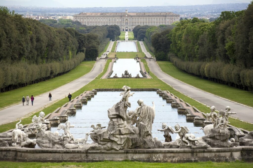 The Caserta Royal Palace seen in the distance, with the garden fountains in the image's foreground