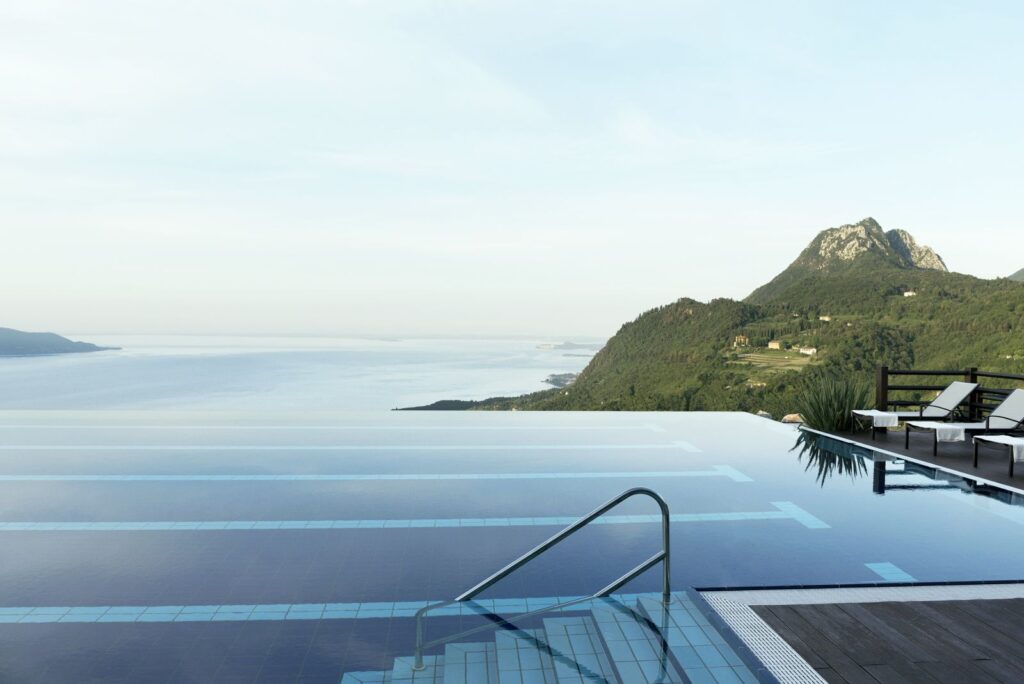Image of a large swimming pool facing Lake Garda in Lefay, one of the best eco resorts in Italy