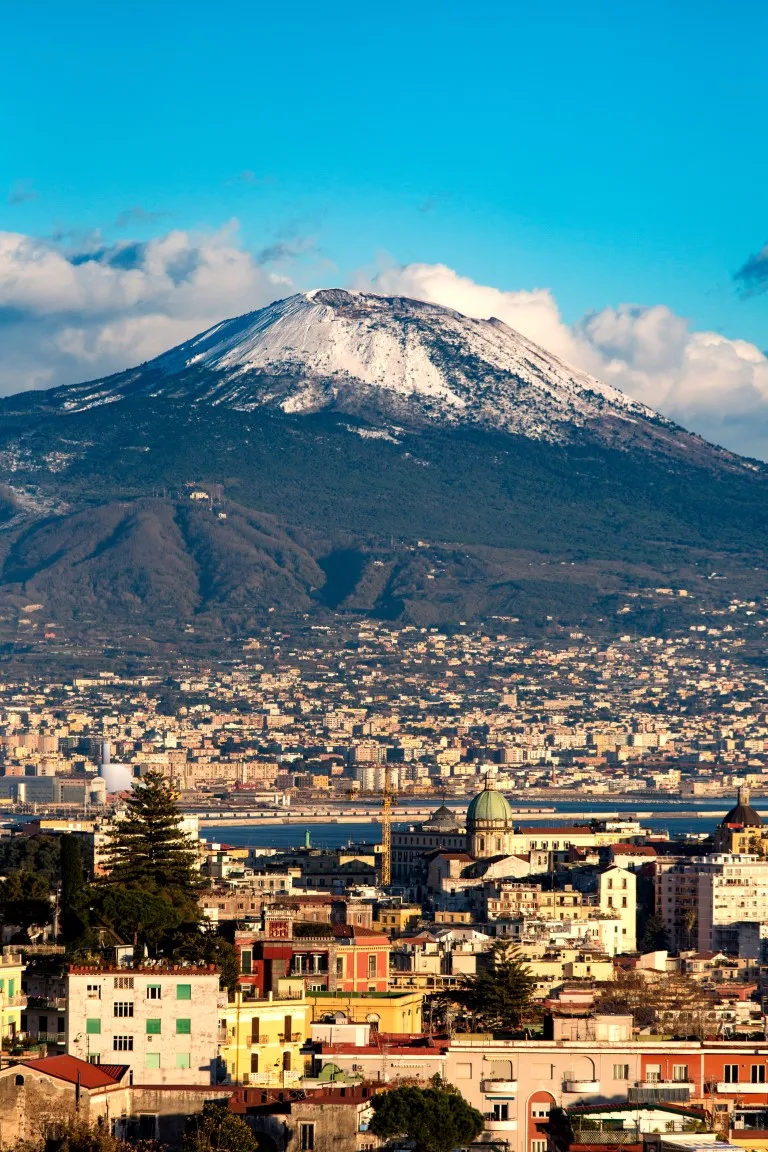 The Vesuvius Volcano in the background, with the city of Naples seen in the foreground of the picture