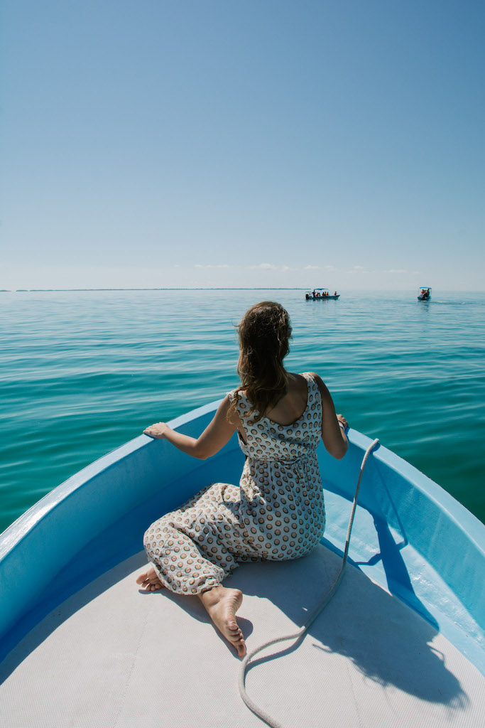 Woman on a boat during a Sian Ka'an tour in Mexico.