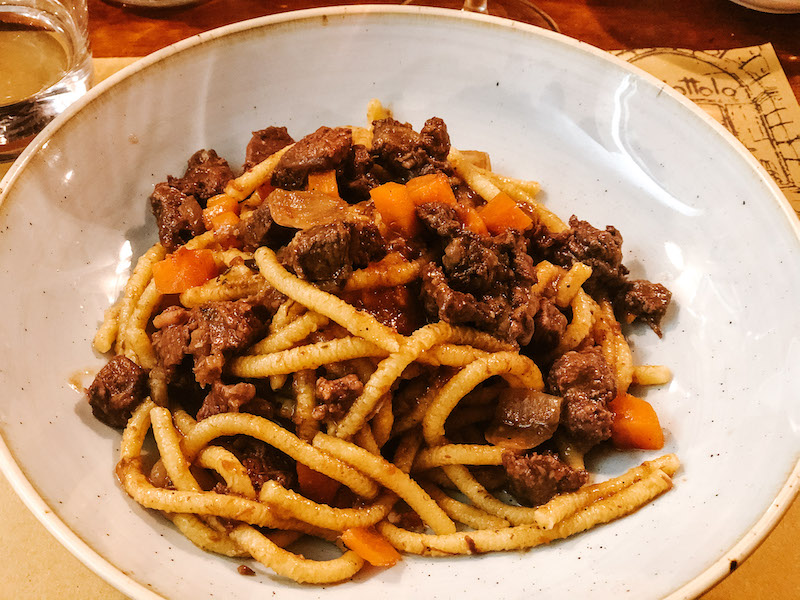 Plate of bigoli with meat, a typical pasta dish of Verona, Italy.