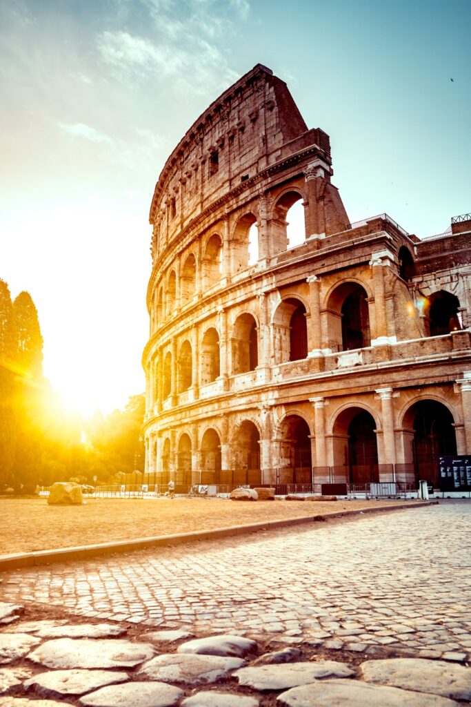 Image of the Roman Colosseum at sunset, inserted in a post about Rome bike tours