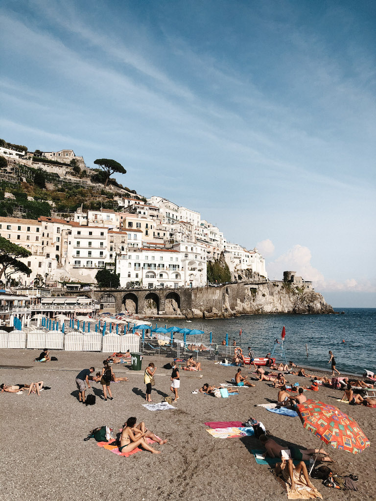 View of arina Grande beach with the town of Amalfi in the background.