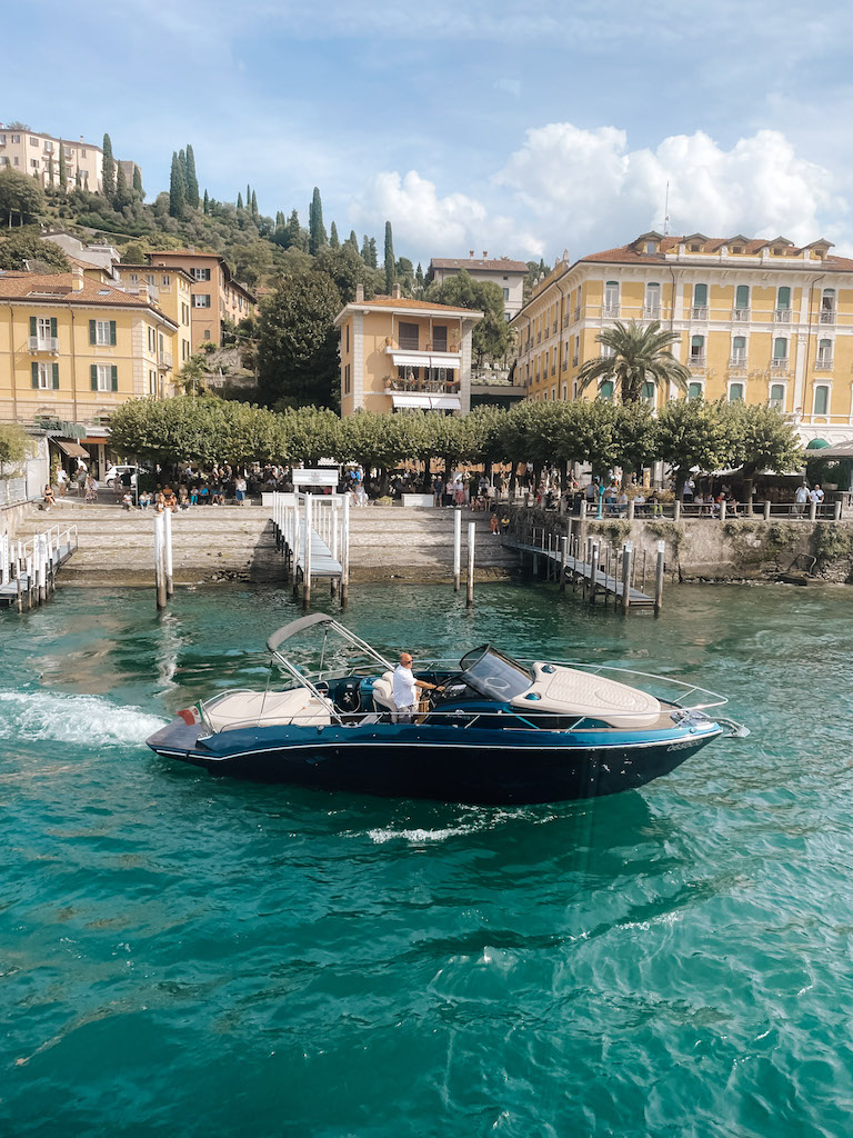 Image of a private boat navigating in front of Bellagio, inserted in a post about the best boat tours of Lake Como.