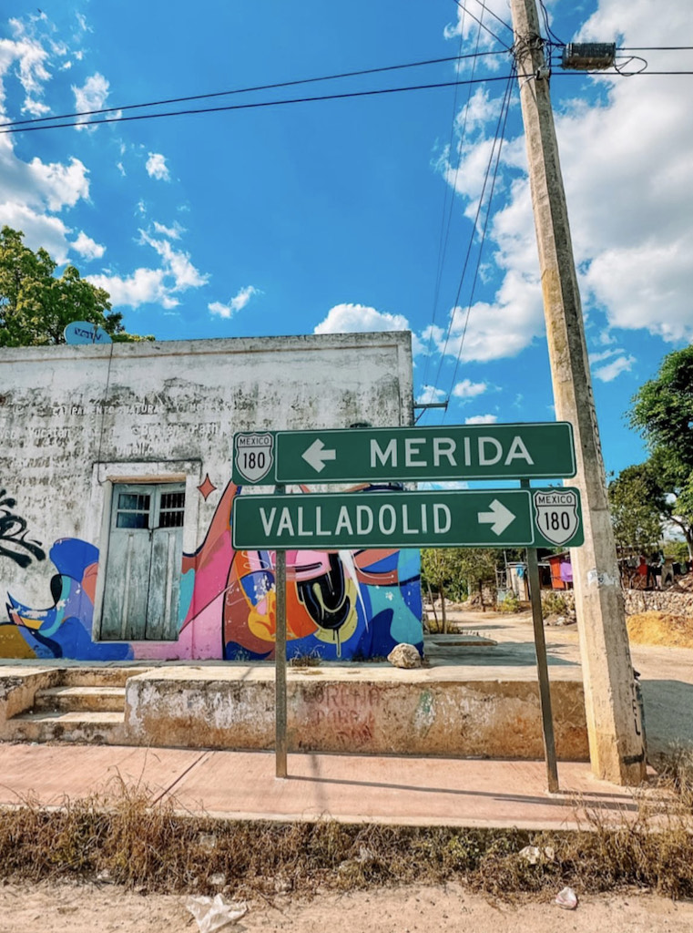 Road signs indicating directions to Merida and Valladolid from Cancun.