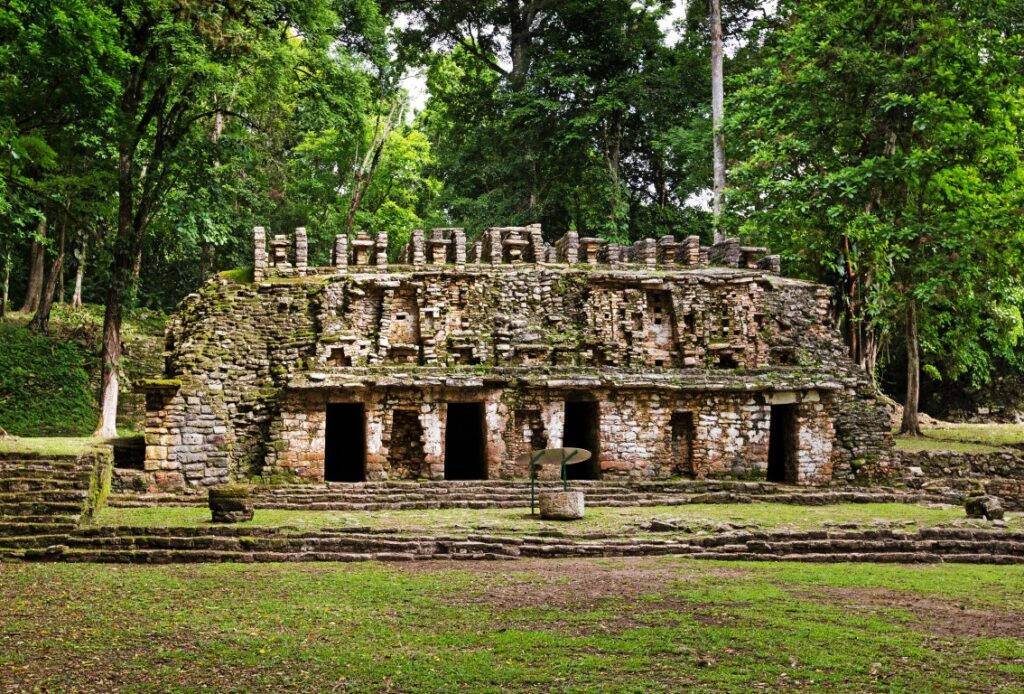 An ancient Mayan ruin surrounded by jungle in Yaxchilan archaeological site