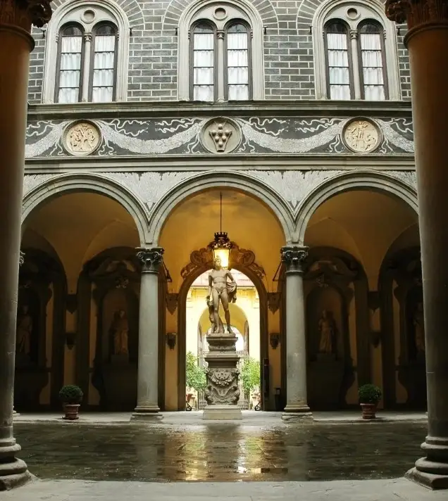 A courtyard in Medici Palace with a statue in the center