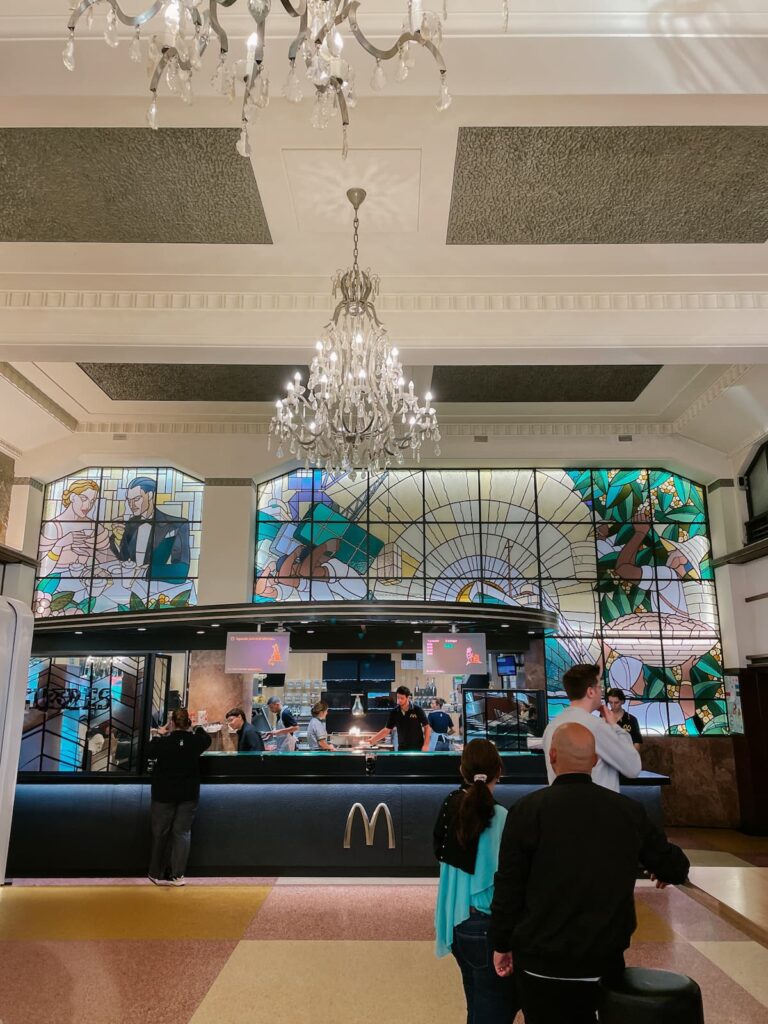 Interior of McDonald’s Imperial in Porto with chandeliers and stained glass windows