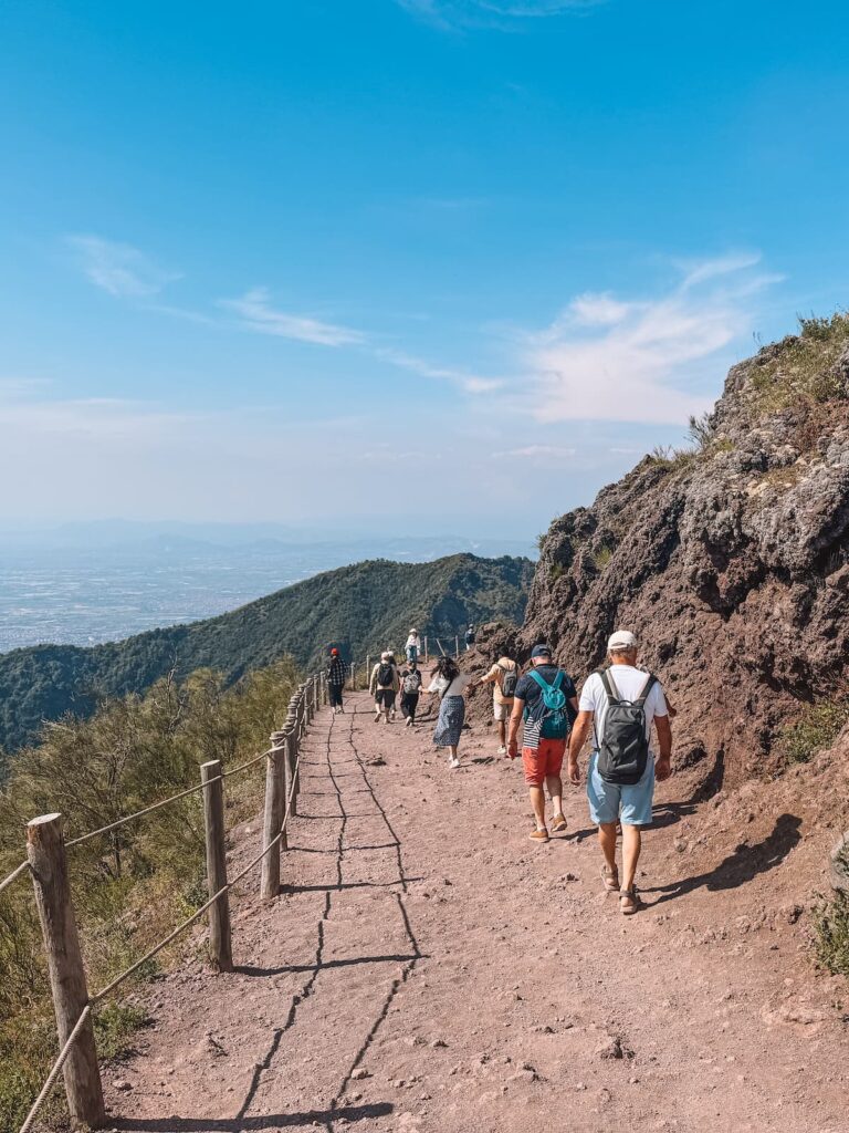 Tourists walking on the trail that leads to the Mount Vesuvius crater.