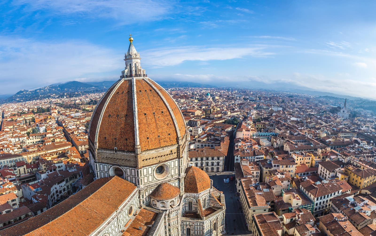 Panoramic view of Florence centered on Brunelleschi&rsquo;s Dome and the red rooftops of the city.