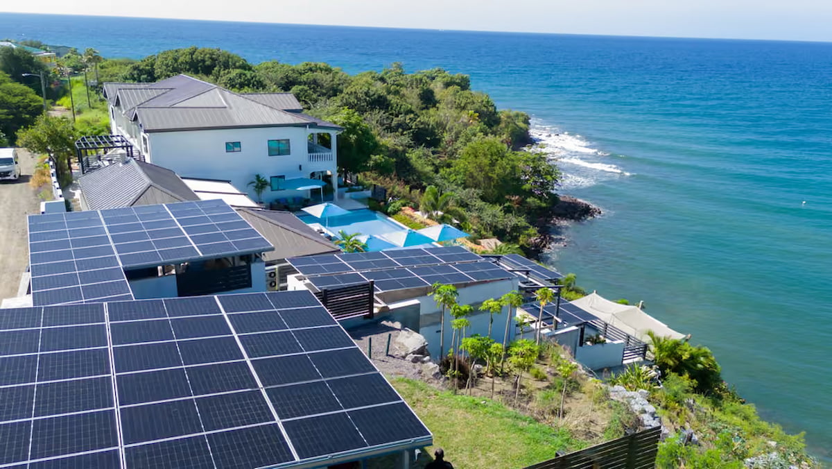 Solar panels and a seaside swimming pool at Sunset Reef in St. Kitts.
